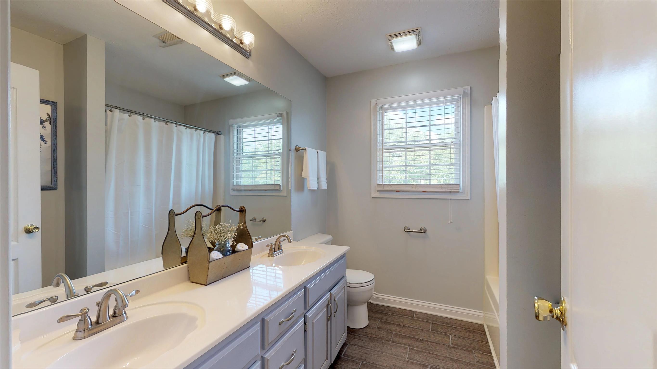 129 Fairfield Road Portland, TN 37148 - Photo 21 of 25 Upstairs full bath is between the two bedrooms with a shower/tub combo and has a double vanity.