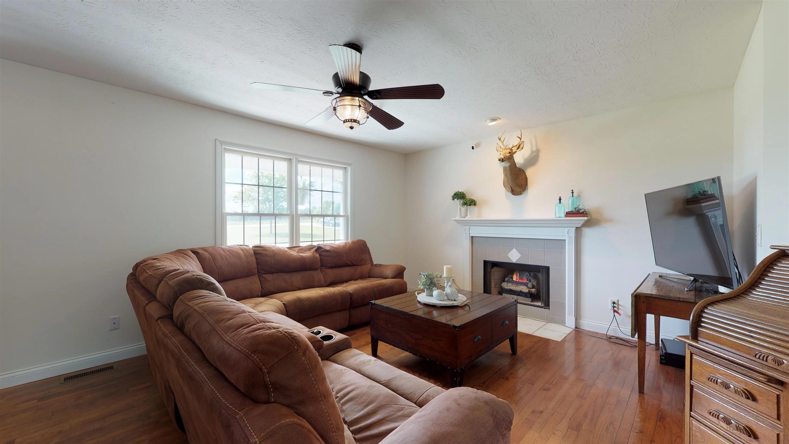 129 Fairfield Road Portland, TN 37148 - Photo 5 of 25 Living area with gas log fireplace.