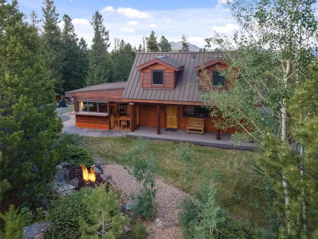 an aerial view of a house with garden space and street view