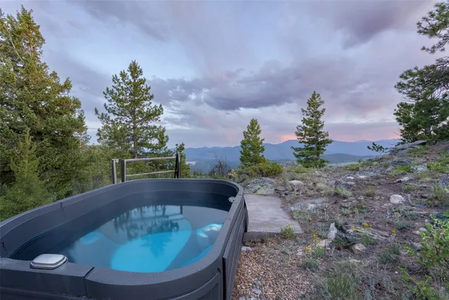 a swimming pool with outdoor seating