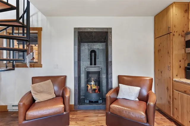 a en suite bathroom with a granite countertop sink and a mirror