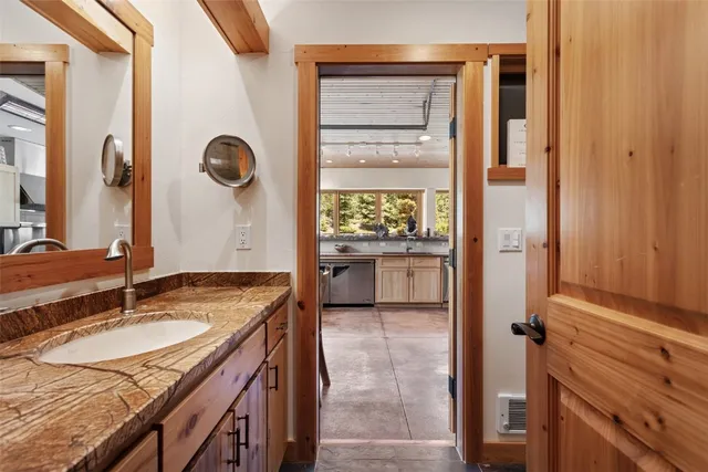 a bathroom with a shower toilet and sink