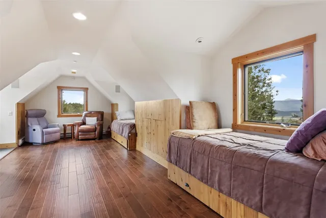 a spacious bedroom with a bed and window