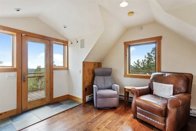 a view of balcony with wooden floor and fence