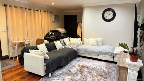 a bedroom with bed and a large mirror