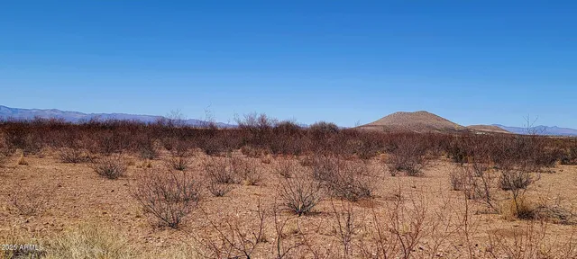 a view of mountains and sunset