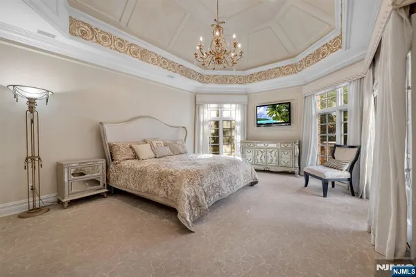 a large bathroom with a large tub and sink