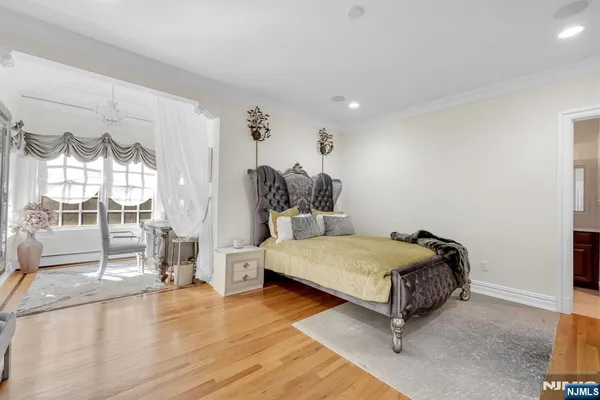 a spacious bedroom with a bed and window