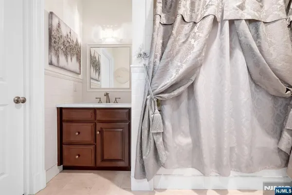 a living room with furniture a window and a table