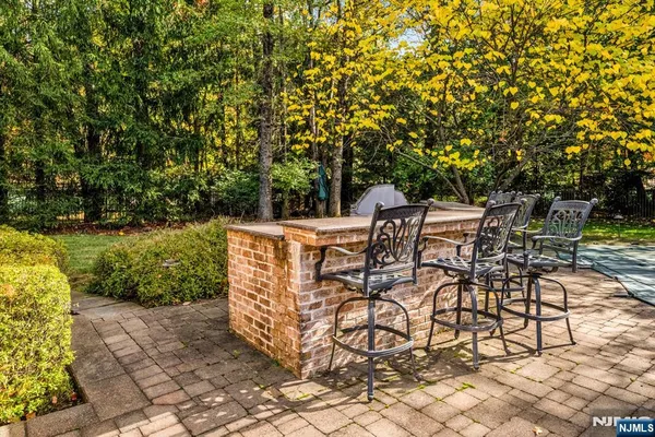 an outdoor sitting area with couch and garden
