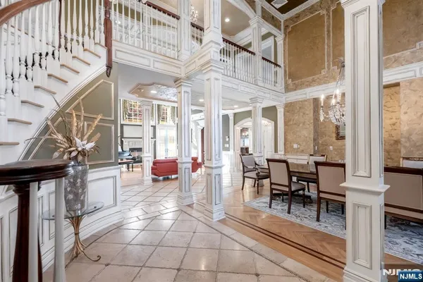 a dining room with furniture and wooden floor