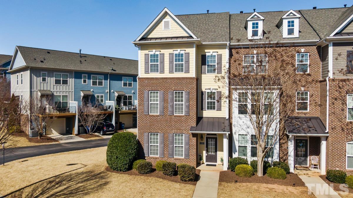 1335 Rodessa Run Raleigh, NC 27607 - Photo 1 of 36 a view of a brick house with many windows