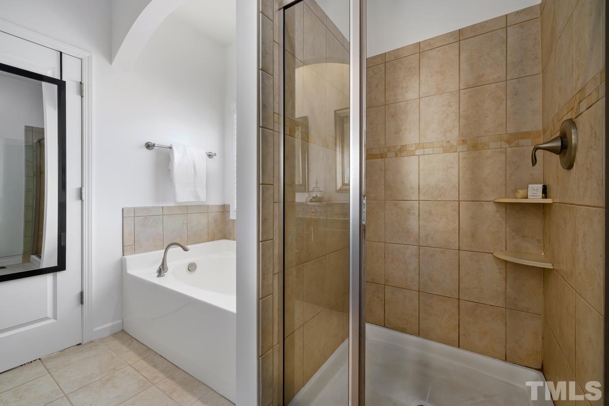 1335 Rodessa Run Raleigh, NC 27607 - Photo 19 of 36 a bathroom with a bathtub and shower