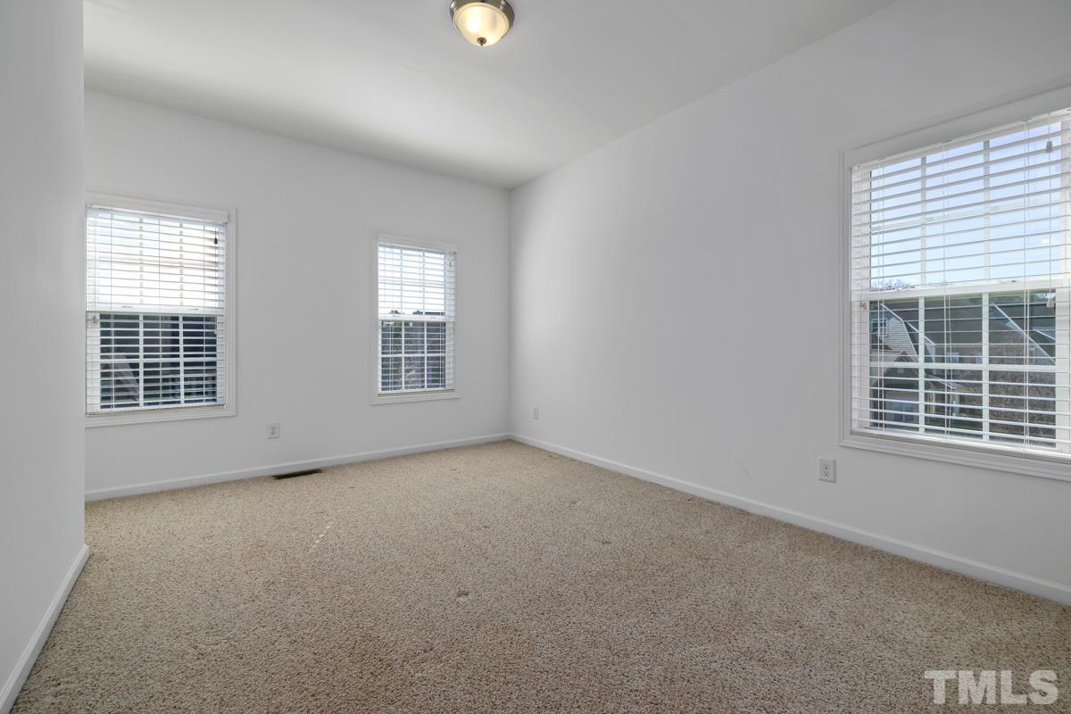 1335 Rodessa Run Raleigh, NC 27607 - Photo 22 of 36 an empty room with windows