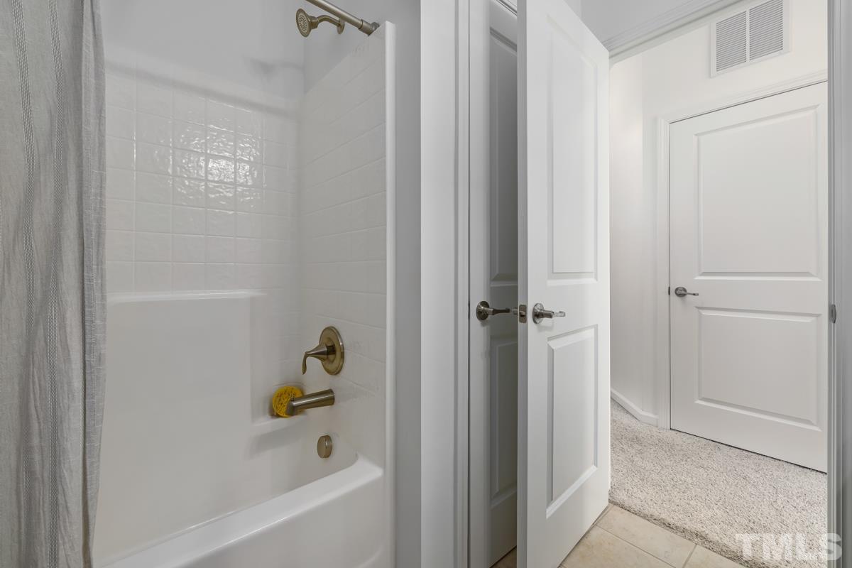 1335 Rodessa Run Raleigh, NC 27607 - Photo 26 of 36 a bathroom with a bathtub