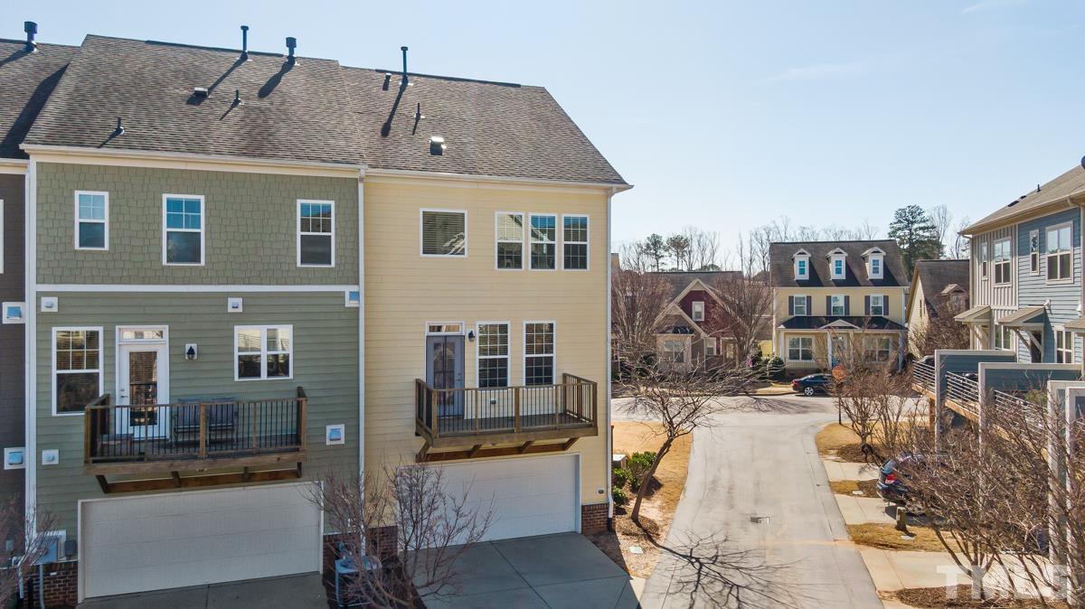 1335 Rodessa Run Raleigh, NC 27607 - Photo 29 of 36 a view of residential houses with cars parked in front of house
