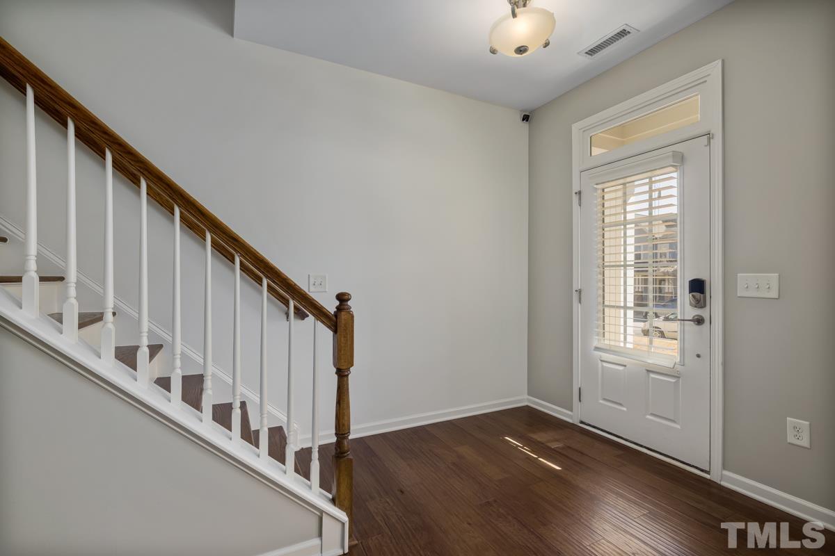 1335 Rodessa Run Raleigh, NC 27607 - Photo 3 of 36 a view of an entryway with hardwood