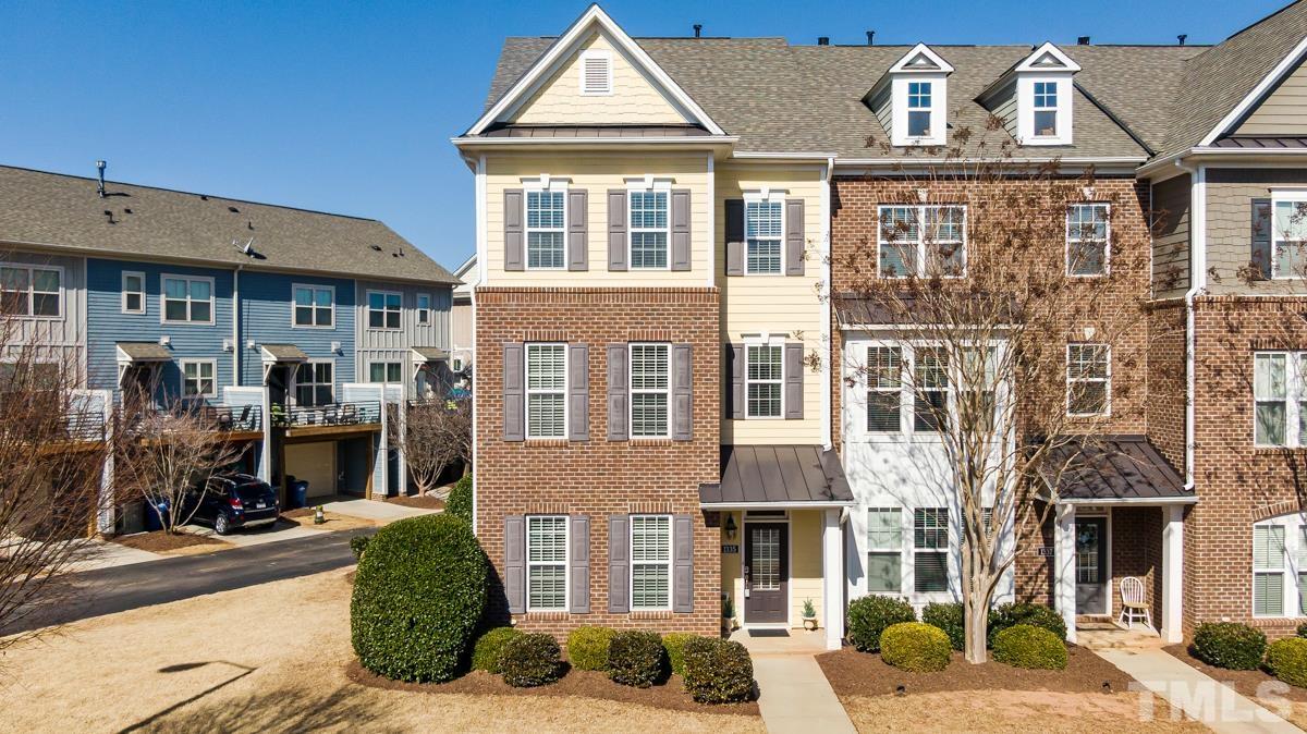 1335 Rodessa Run Raleigh, NC 27607 - Photo 36 of 36 a front view of a residential apartment building with a yard