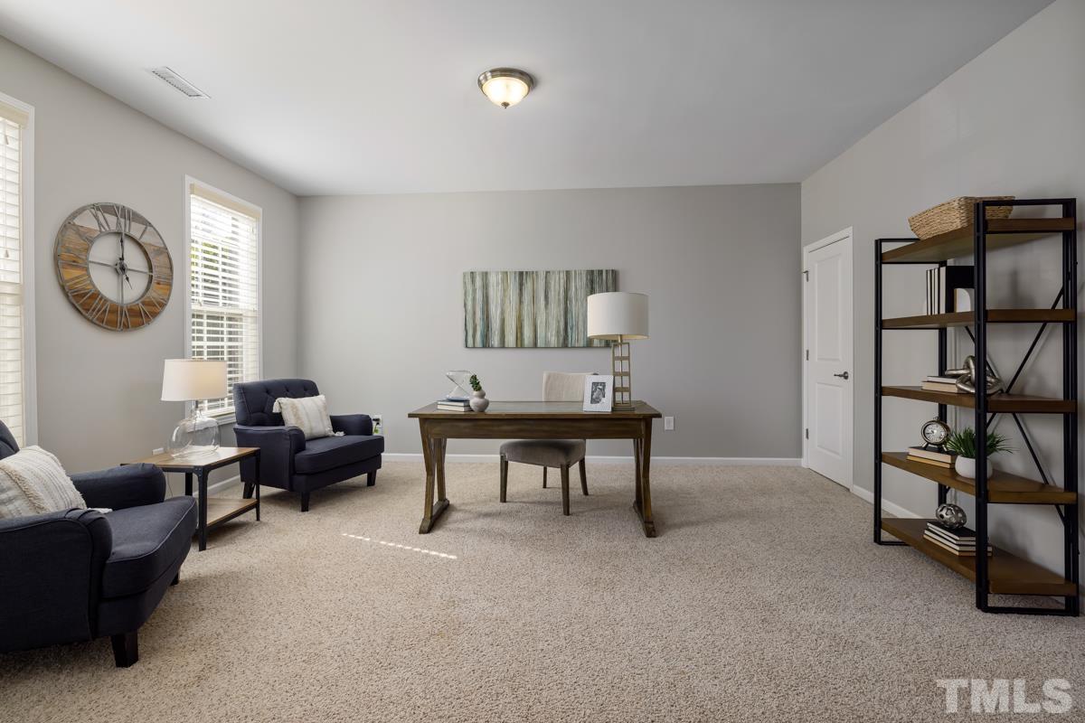 1335 Rodessa Run Raleigh, NC 27607 - Photo 4 of 36 a living room with furniture and a window