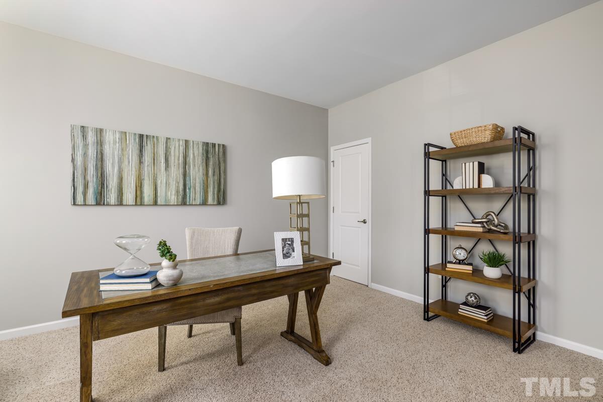1335 Rodessa Run Raleigh, NC 27607 - Photo 6 of 36 a view of a workspace with furniture and a window