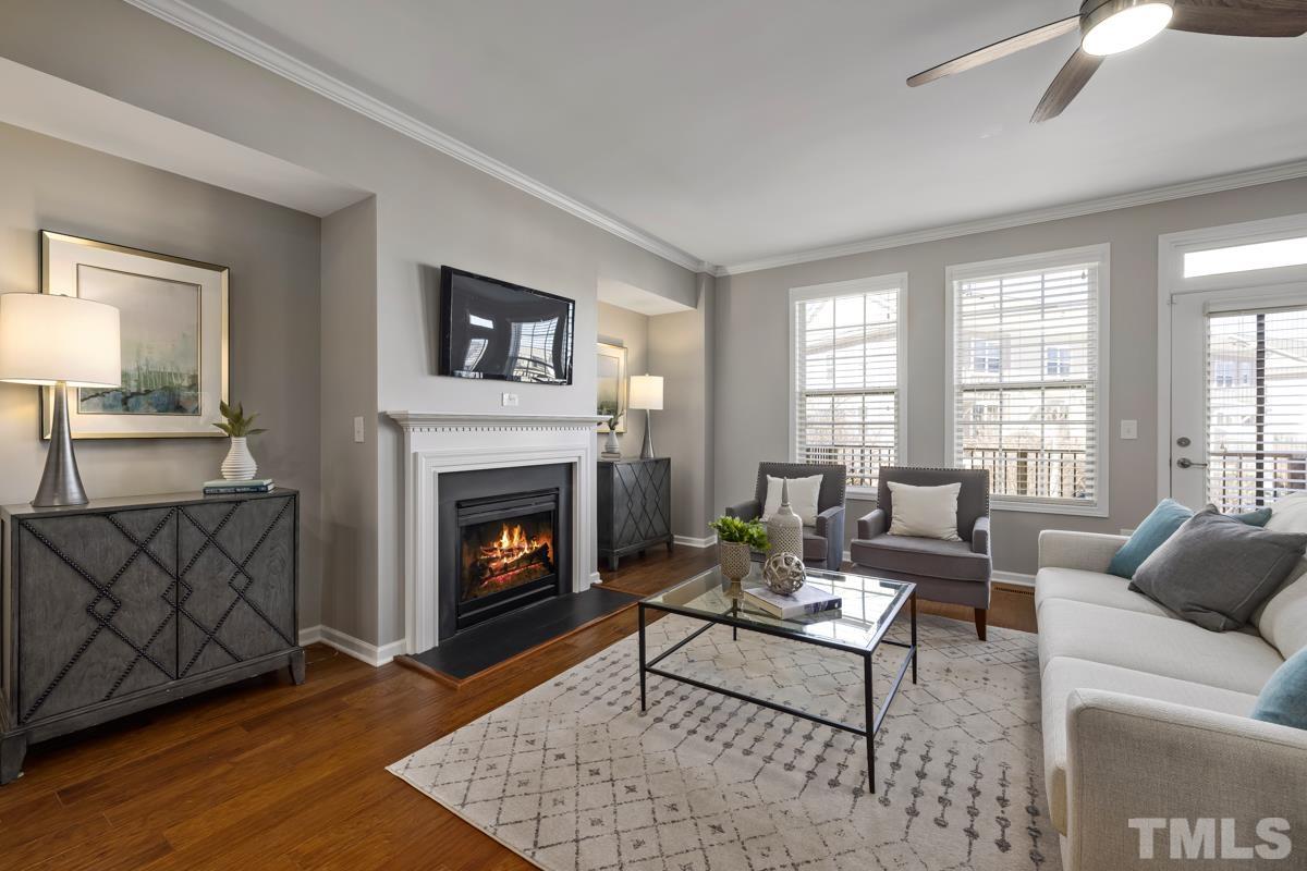 1335 Rodessa Run Raleigh, NC 27607 - Photo 8 of 36 a living room with furniture and a fireplace