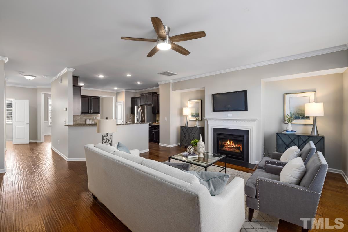 1335 Rodessa Run Raleigh, NC 27607 - Photo 9 of 36 a living room with furniture and a fireplace