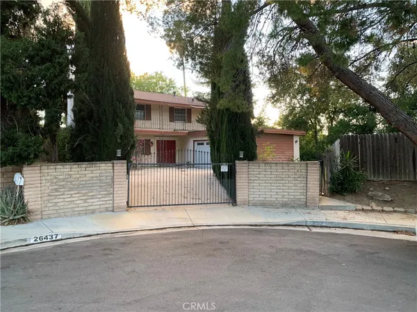 front view of a house with a road