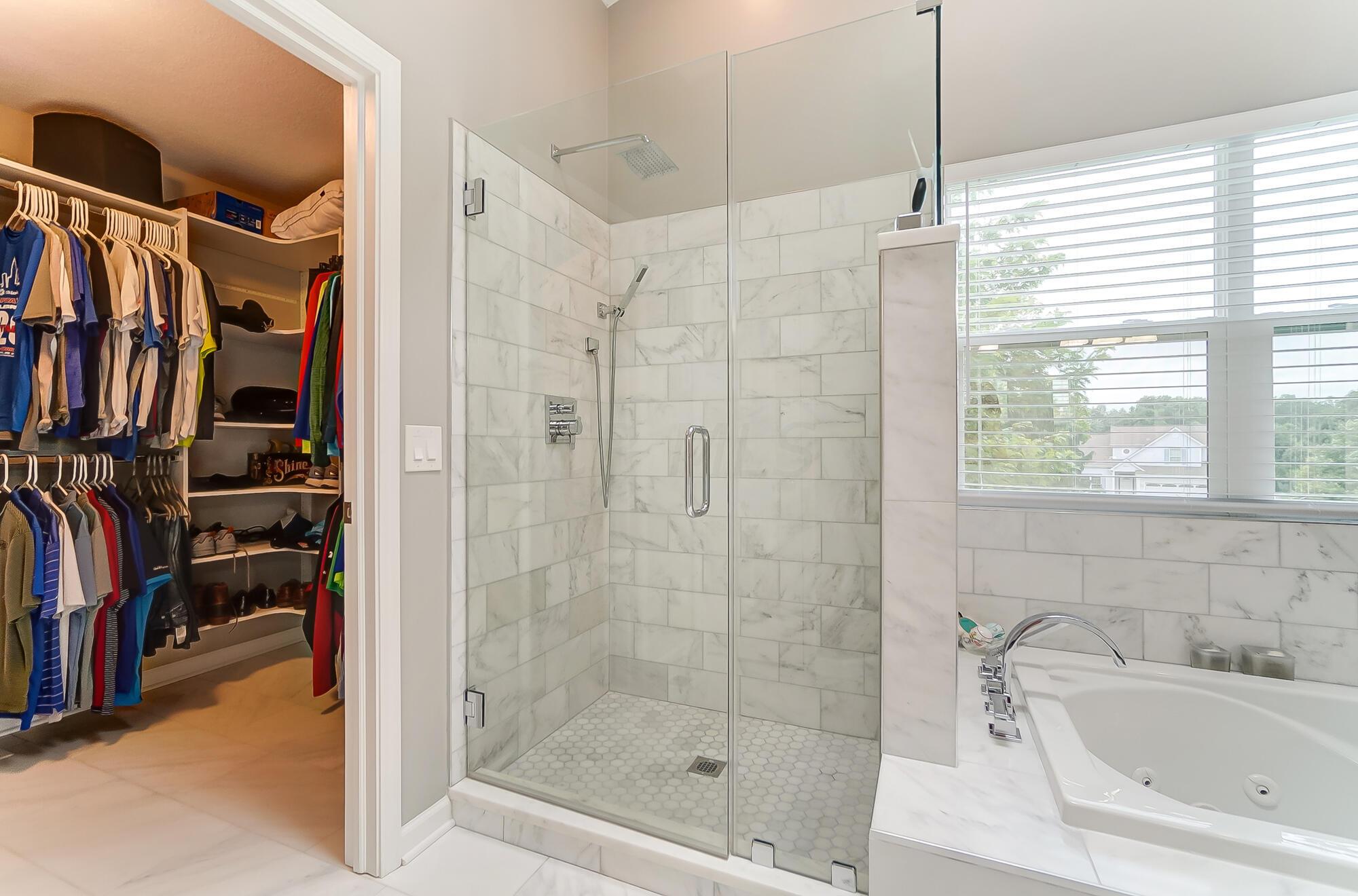 5674 Steward Road Galena, OH 43021 - Photo 56 of 82 New shower has seamless glass doors, up to date tile along with state of the are fixtures.