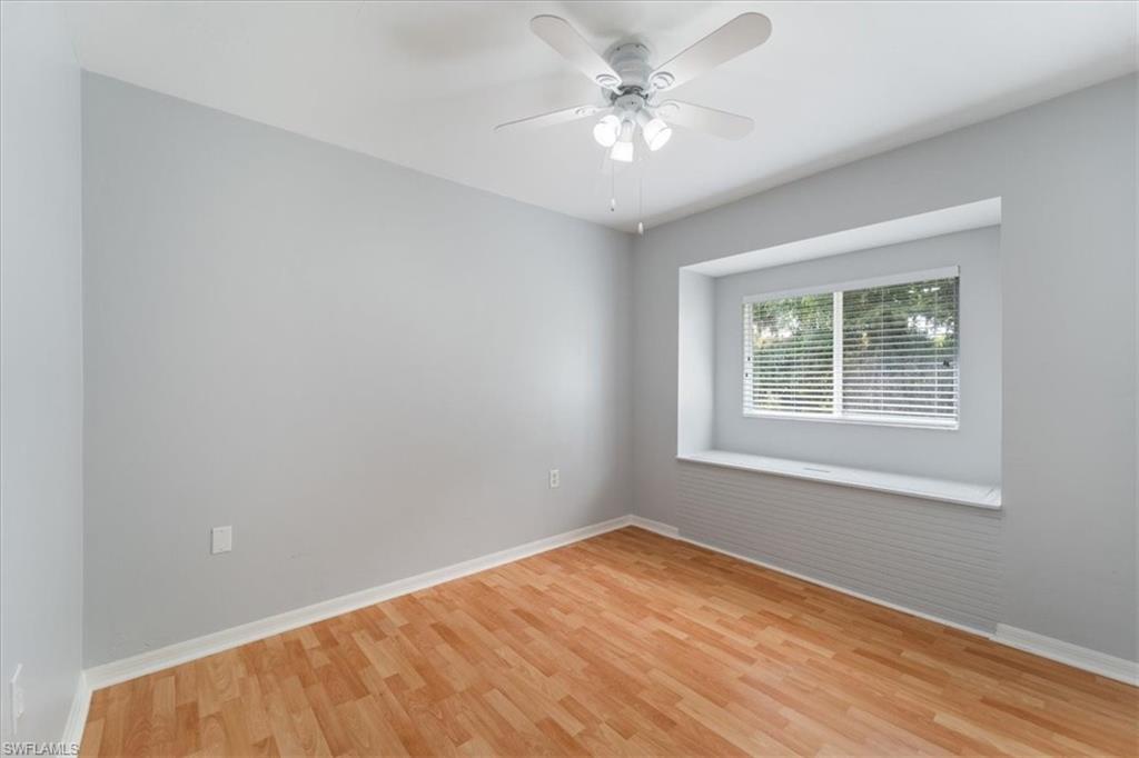 1161 25th Street Southwest Naples, FL 34117 - Photo 15 of 23 an empty room with a window