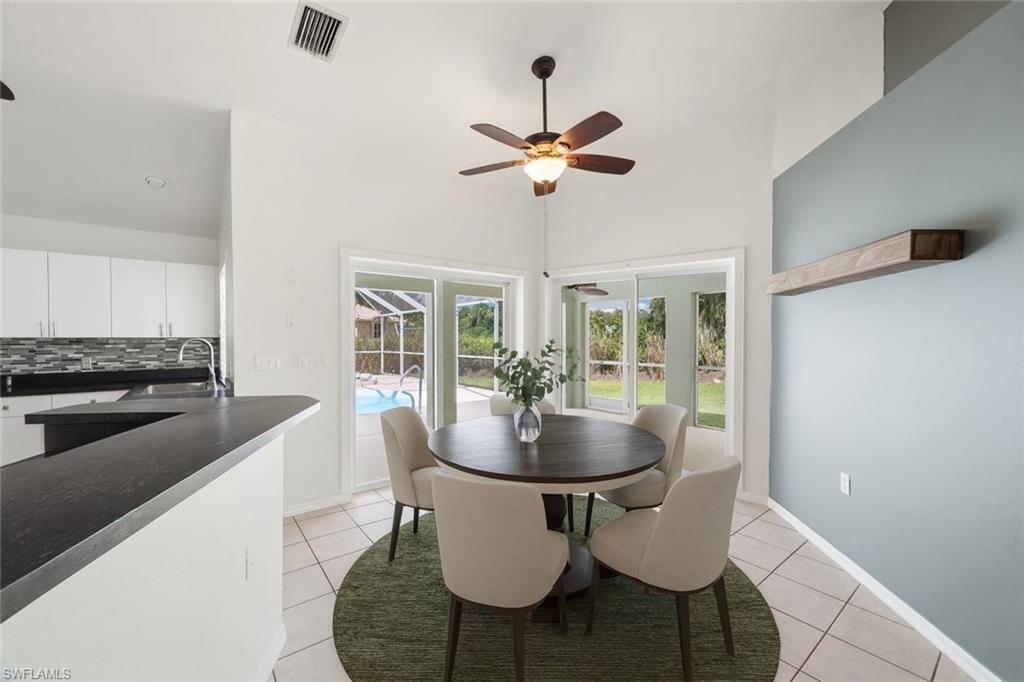 1161 25th Street Southwest Naples, FL 34117 - Photo 23 of 23 a kitchen with a table and chairs