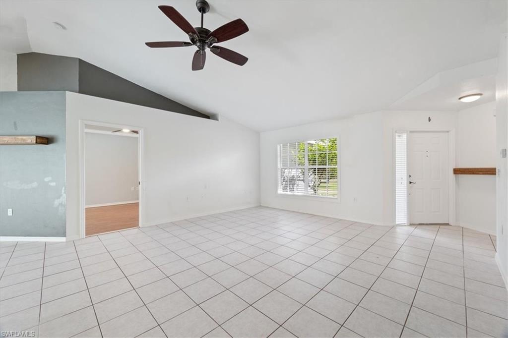 1161 25th Street Southwest Naples, FL 34117 - Photo 6 of 23 a view of an empty room and window
