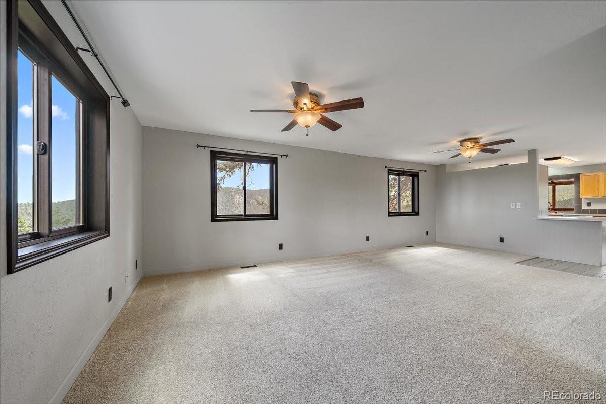 32482 Lodgepole Drive Evergreen, CO 80439 - Photo 11 of 40 a view of an empty room with a window