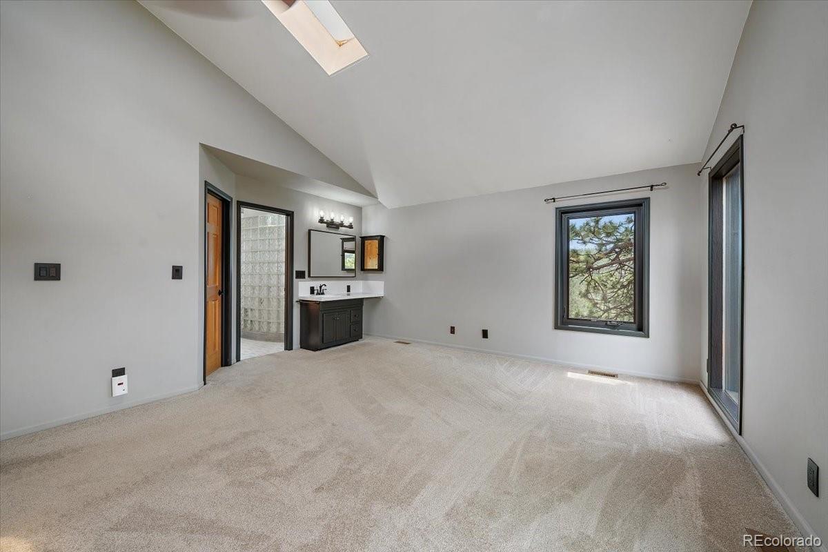 32482 Lodgepole Drive Evergreen, CO 80439 - Photo 15 of 40 a view of an empty room with window and cabinet