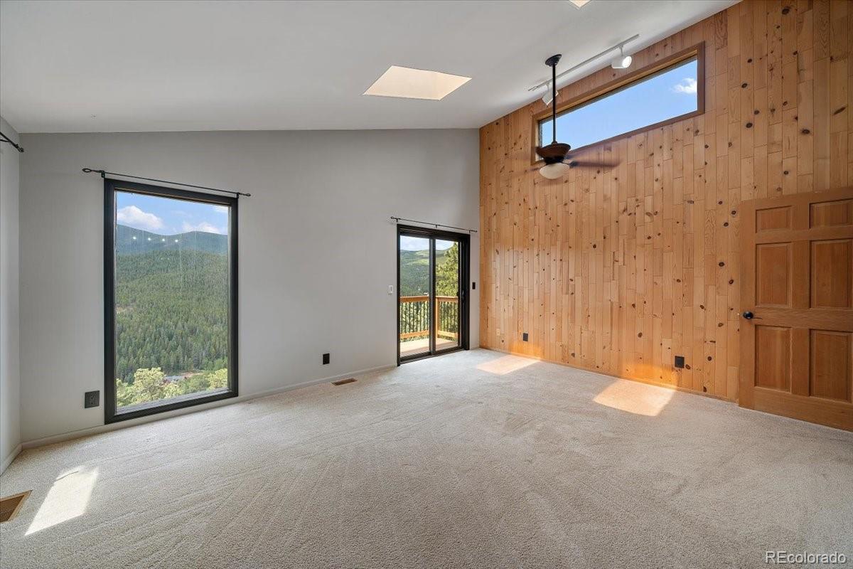 32482 Lodgepole Drive Evergreen, CO 80439 - Photo 16 of 40 a view of an empty room with a window