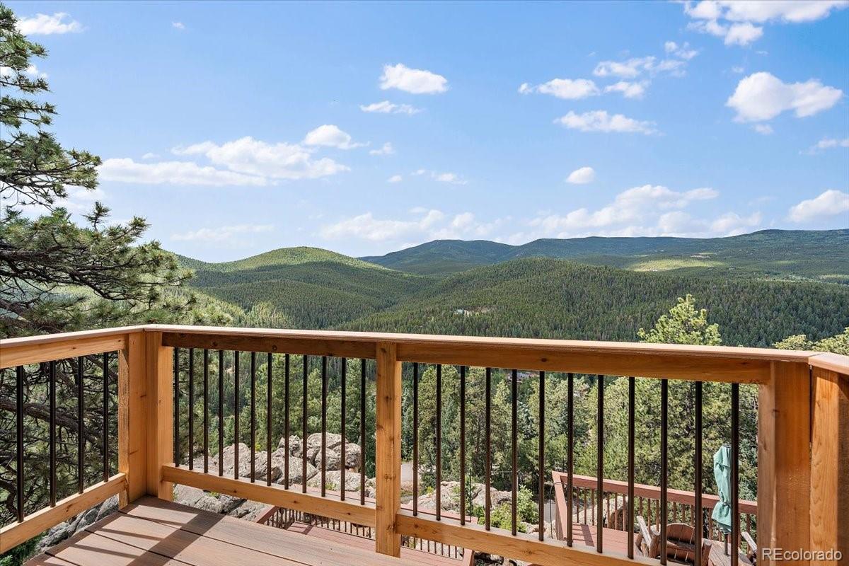32482 Lodgepole Drive Evergreen, CO 80439 - Photo 18 of 40 a city view from a balcony