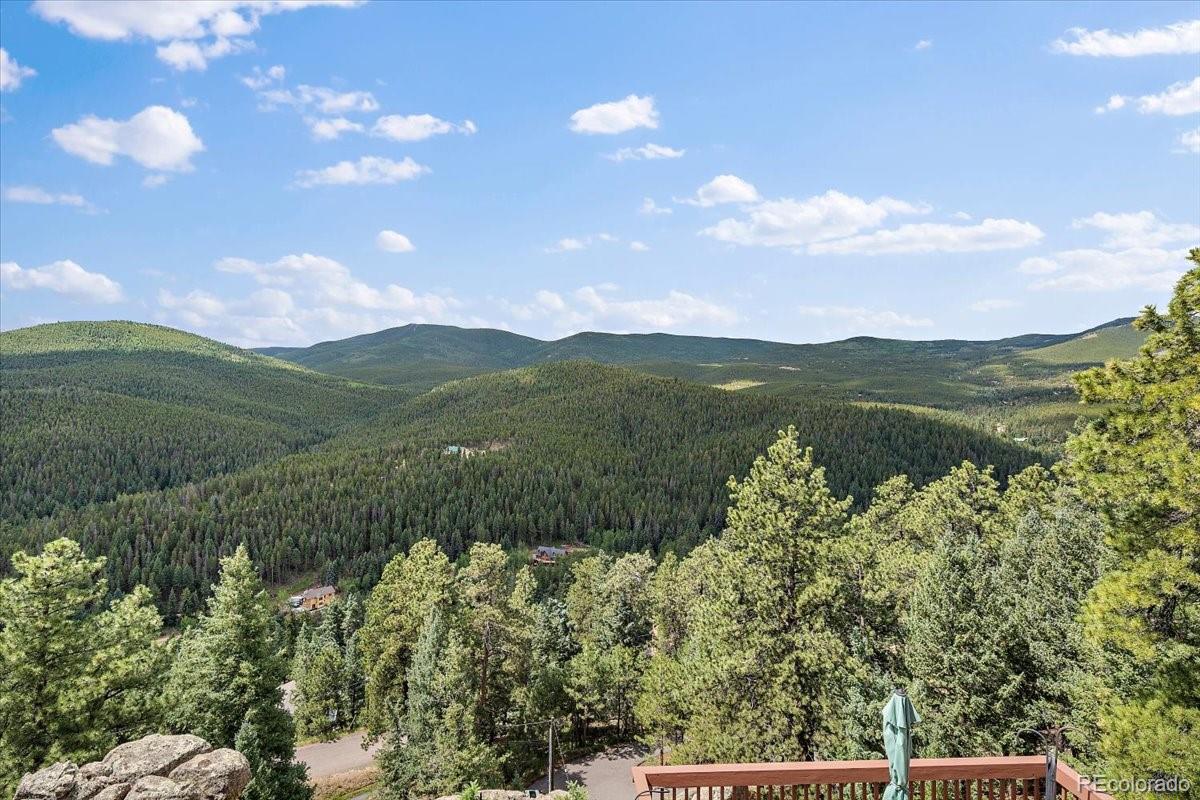 32482 Lodgepole Drive Evergreen, CO 80439 - Photo 19 of 40 a view of a lake with a mountain in the background