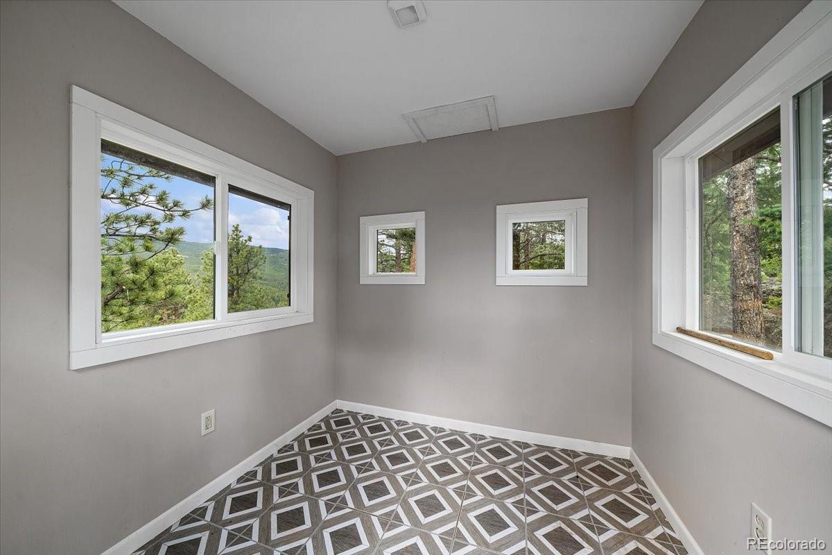 32482 Lodgepole Drive Evergreen, CO 80439 - Photo 37 of 40 a view of an empty room with a window