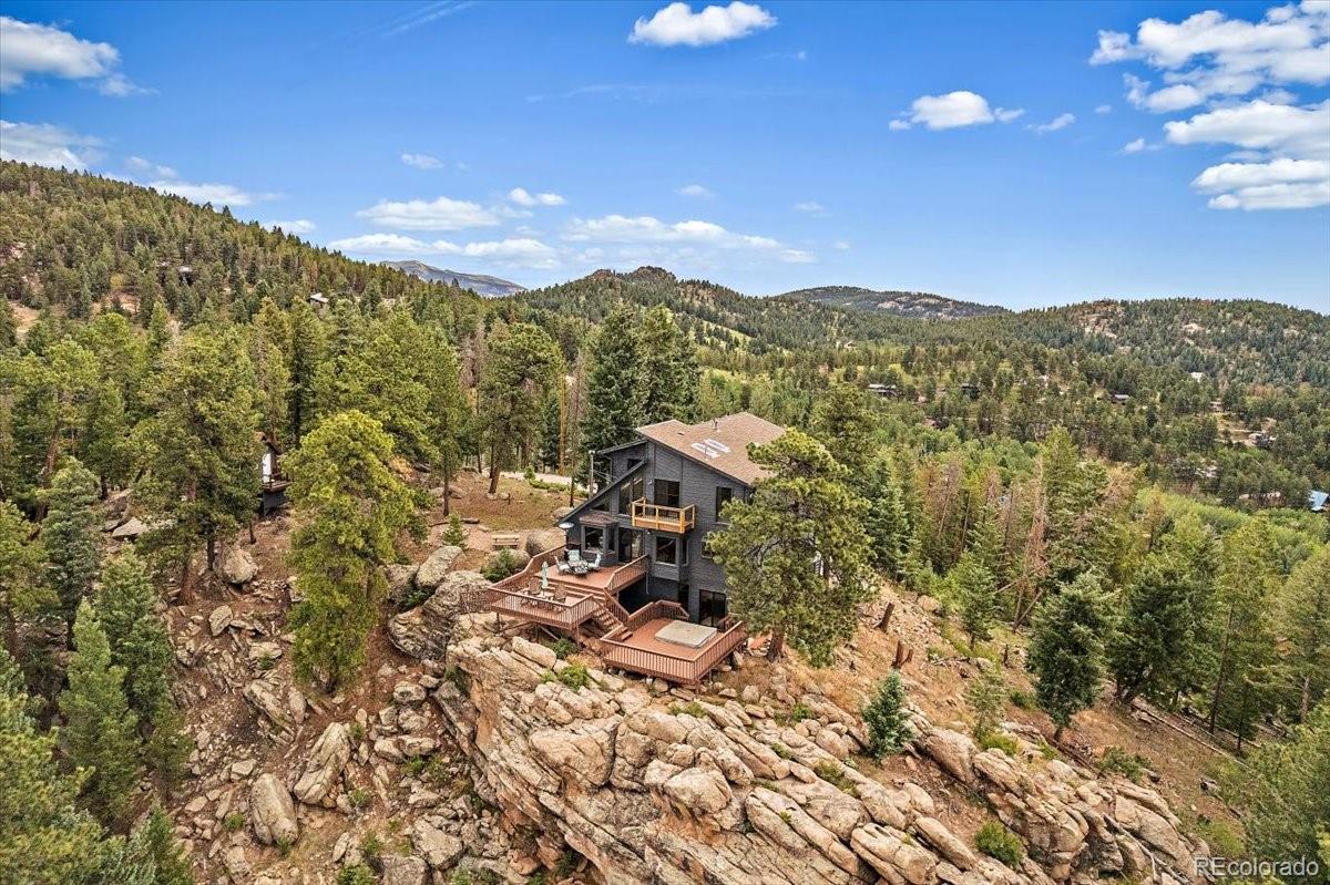 32482 Lodgepole Drive Evergreen, CO 80439 - Photo 38 of 40 a view of a city with sunset view