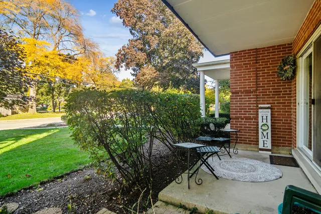 a backyard of a house with outdoor seating