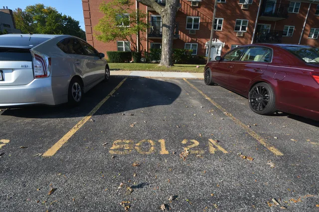 a front view of a house with parking space