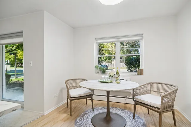 a view of a dining room with furniture window and outside view