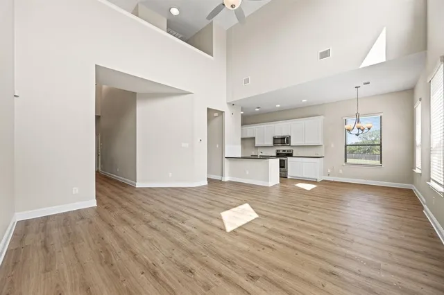 a view of kitchen with cabinets and wooden floor