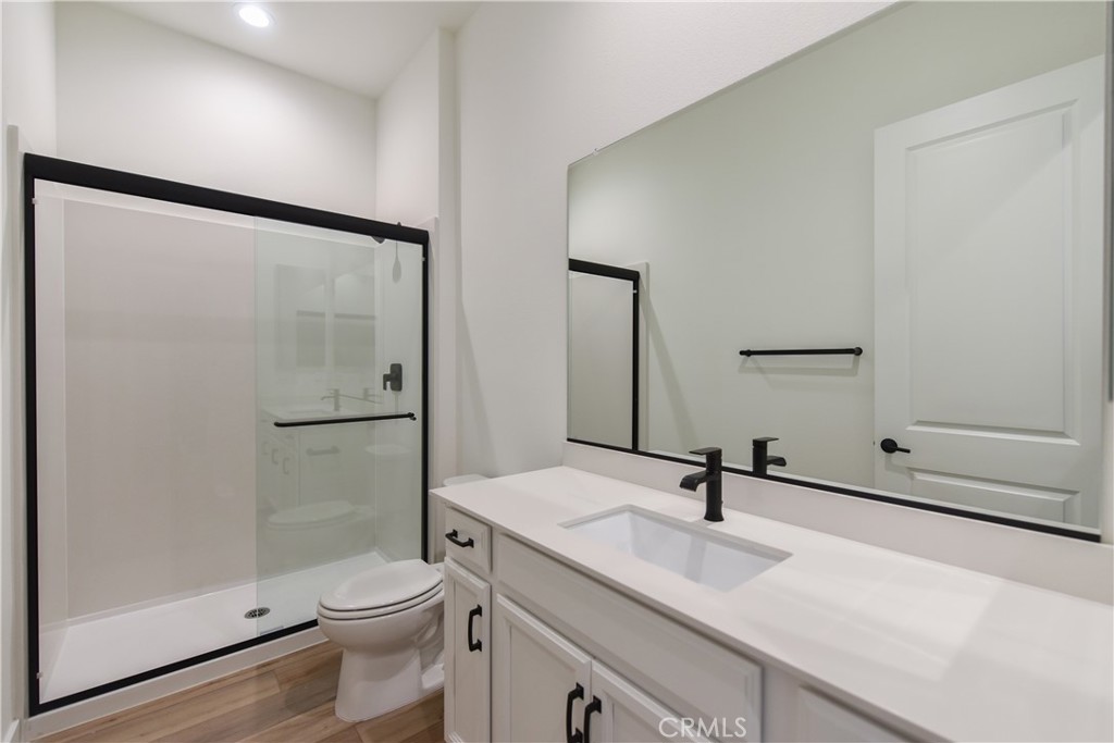 162 Pattern Irvine, CA 92618 - Photo 18 of 39 a bathroom with a sink toilet a mirror and shower