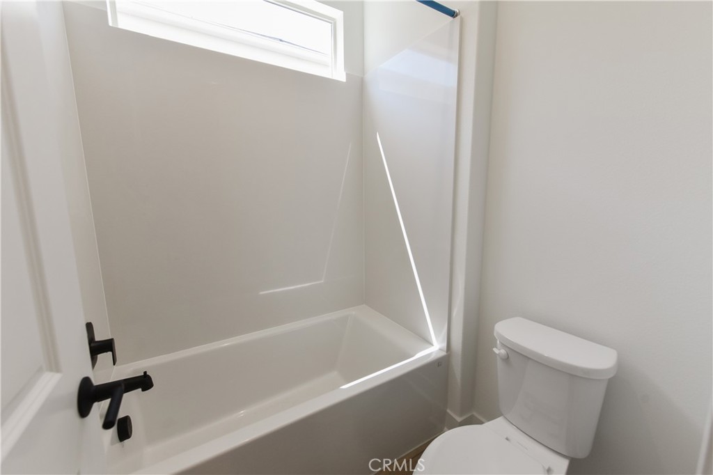 162 Pattern Irvine, CA 92618 - Photo 33 of 39 a white toilet sitting next to a bath tub