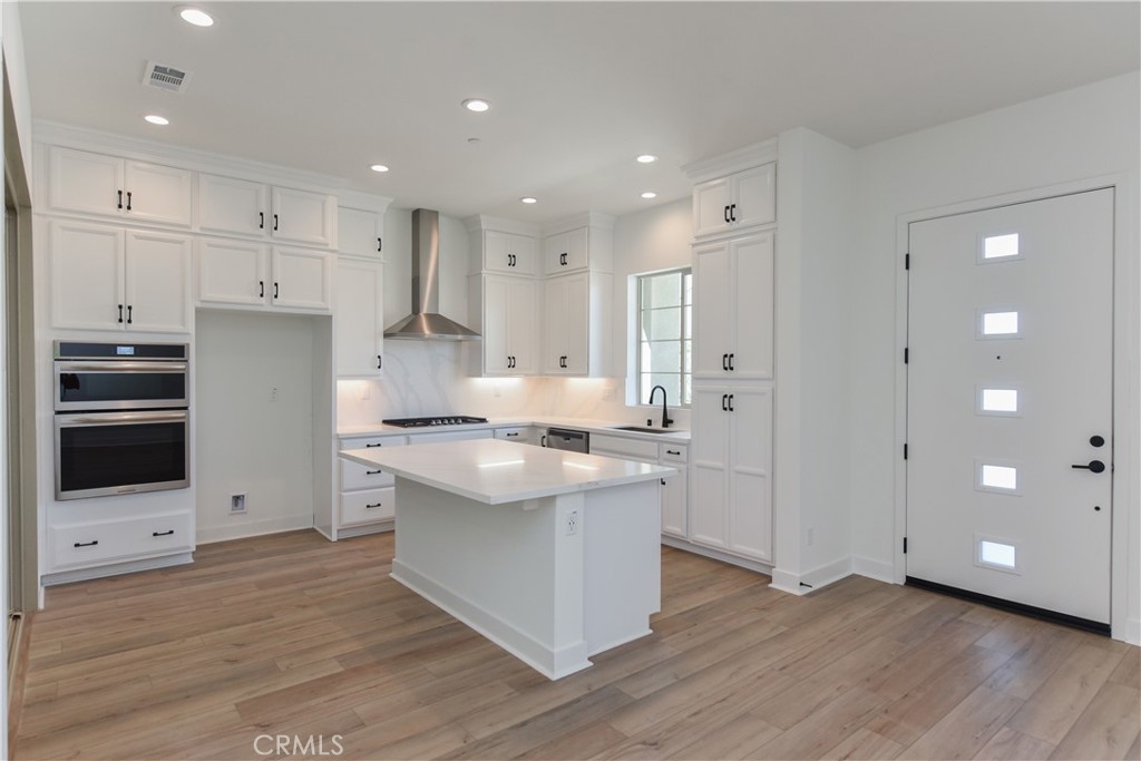 162 Pattern Irvine, CA 92618 - Photo 10 of 39 a kitchen with stainless steel appliances granite countertop a stove and a refrigerator
