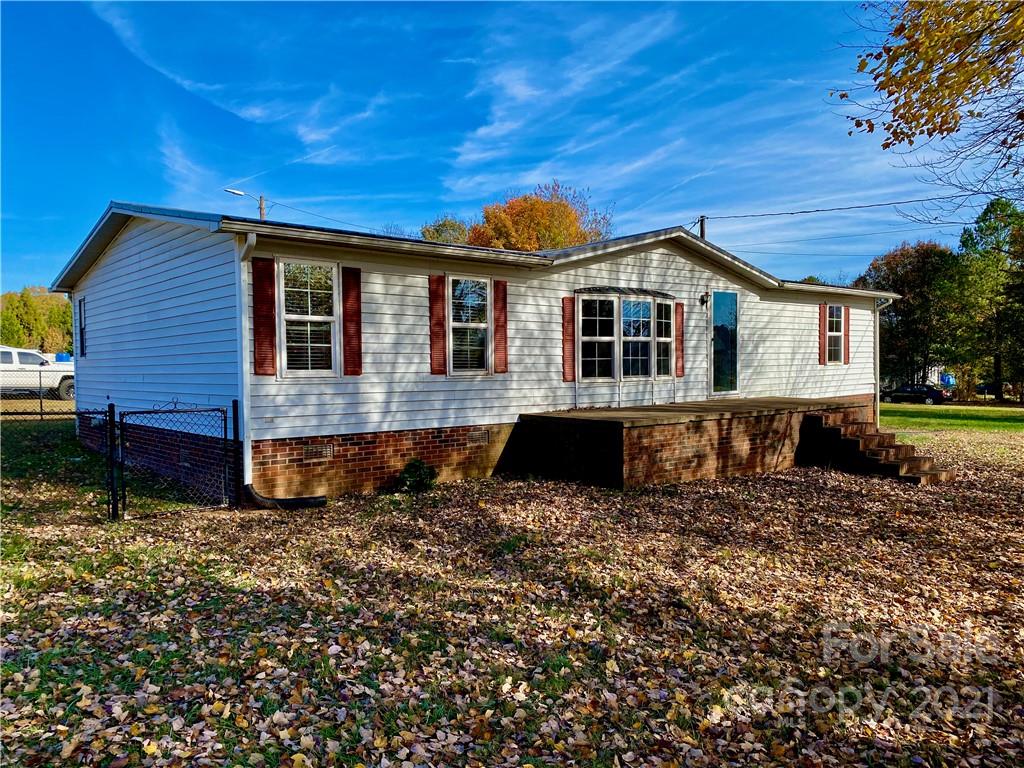 6102 Bill Sain Road Vale, NC 28168 - Photo 1 of 13 a front view of a house with a yard
