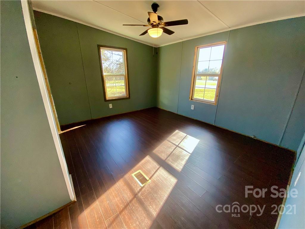 6102 Bill Sain Road Vale, NC 28168 - Photo 9 of 13 wooden floor in an empty room with a window