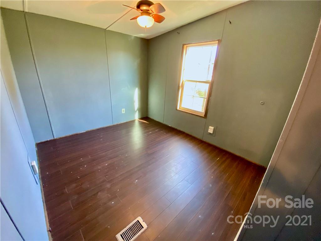 6102 Bill Sain Road Vale, NC 28168 - Photo 10 of 13 a view of room with window and hardwood floor