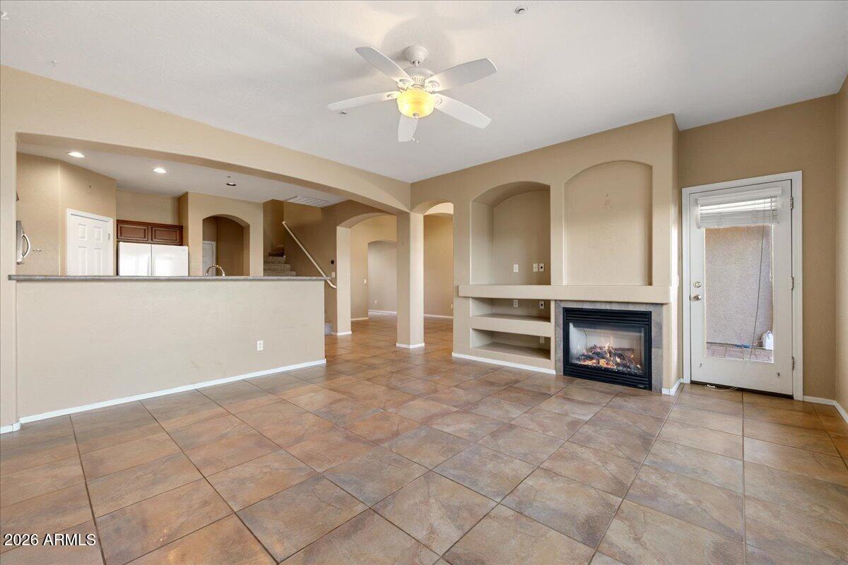813 Alfonse Road Clarkdale, AZ 86324 - Photo 29 of 41 an empty room with windows and a fireplace