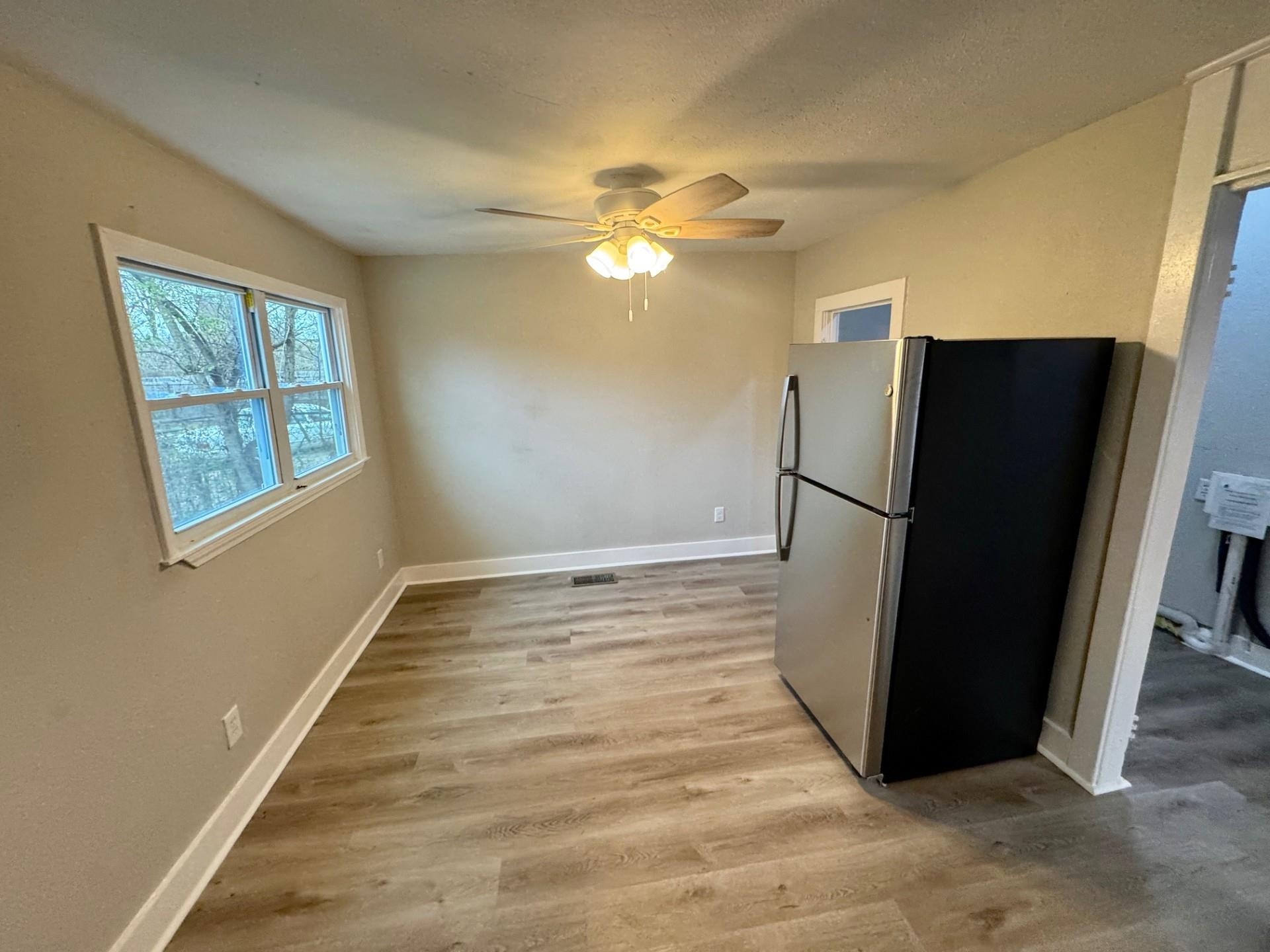 879 Tully Street Memphis, TN 38107 - Photo 6 of 12 a view of an empty room with a window